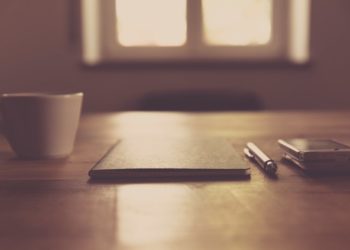 A coffee, a notebook, ready to go.