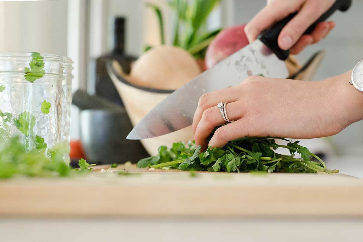 Chopping vegetables. Photo: Alyson McPhee/Unsplash