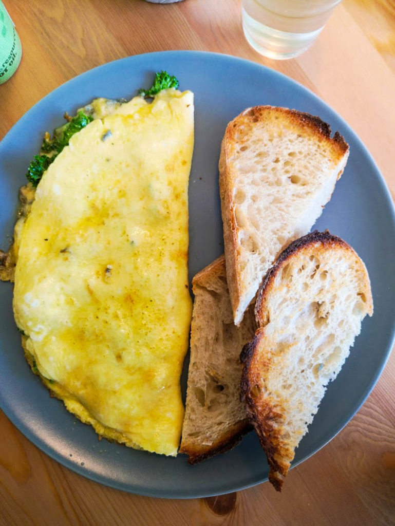 Three egg omelette with kale, Cashel Blue cheese and sourdough toast.