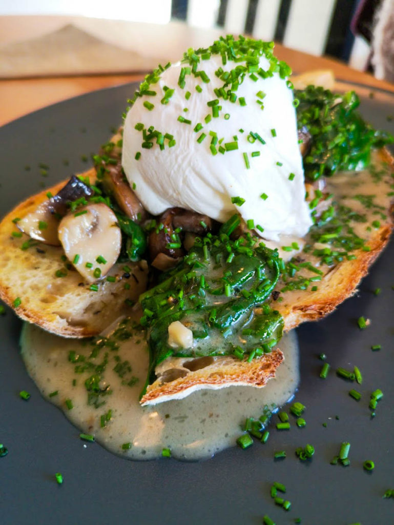 Chestnut mushrooms with spinach on sourdough, topped with a poached egg.