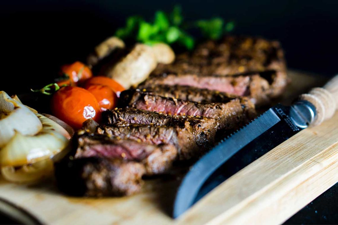 Steak on a chopping board. Photo: amirali mirhashemian/Unsplash