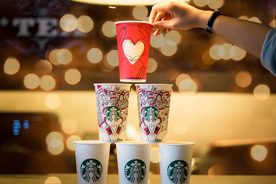 Starbucks coffee cups. Photo: Quan Le/Unsplash