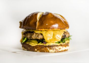 A cheeseburger in a brioche bun. Photo: Amirali Mirhashemian/Unsplash