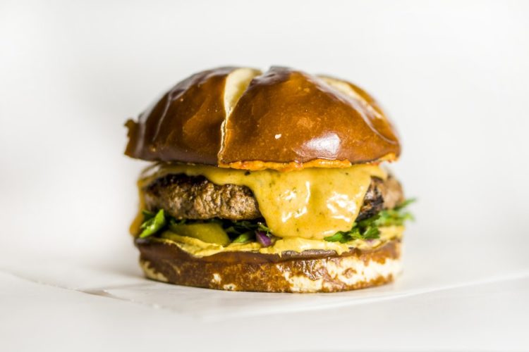 A cheeseburger in a brioche bun. Photo: Amirali Mirhashemian/Unsplash