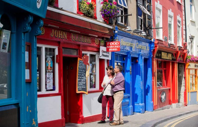A couple outside John Cleere's, Parliament Street, Kilkenny. Photo: Brian Morrison/Tourism Ireland