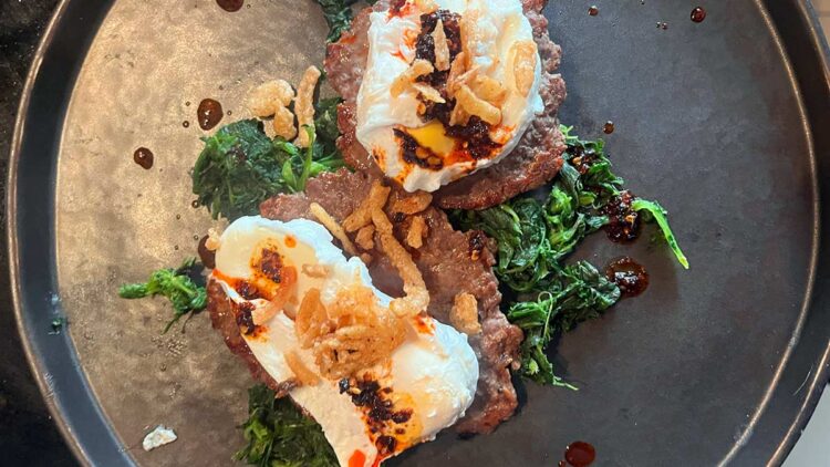 Beef, poached eggs and crispy onions. Photo: Ken McGuire / Ken On Food