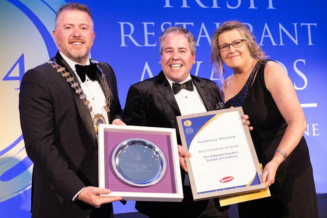 Edward Hayden (centre), collected the Best Cookery School award at the 2024 Irish Restaurant Awards gala final